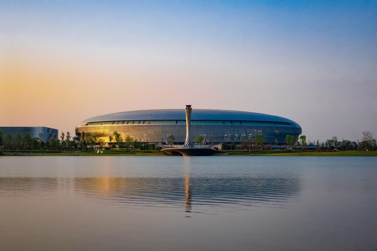 lake  bridge  stadium  torch  park  dong'an lake  chengdu  china  universiade  world university games  sky  fisu world university games  nature  sports meeting 