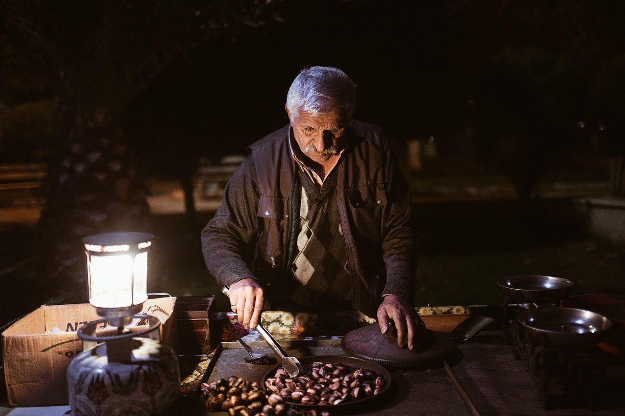old man night chestnuts peddler street vendor vendor market night market elderly man old man old man old man old man old man market market