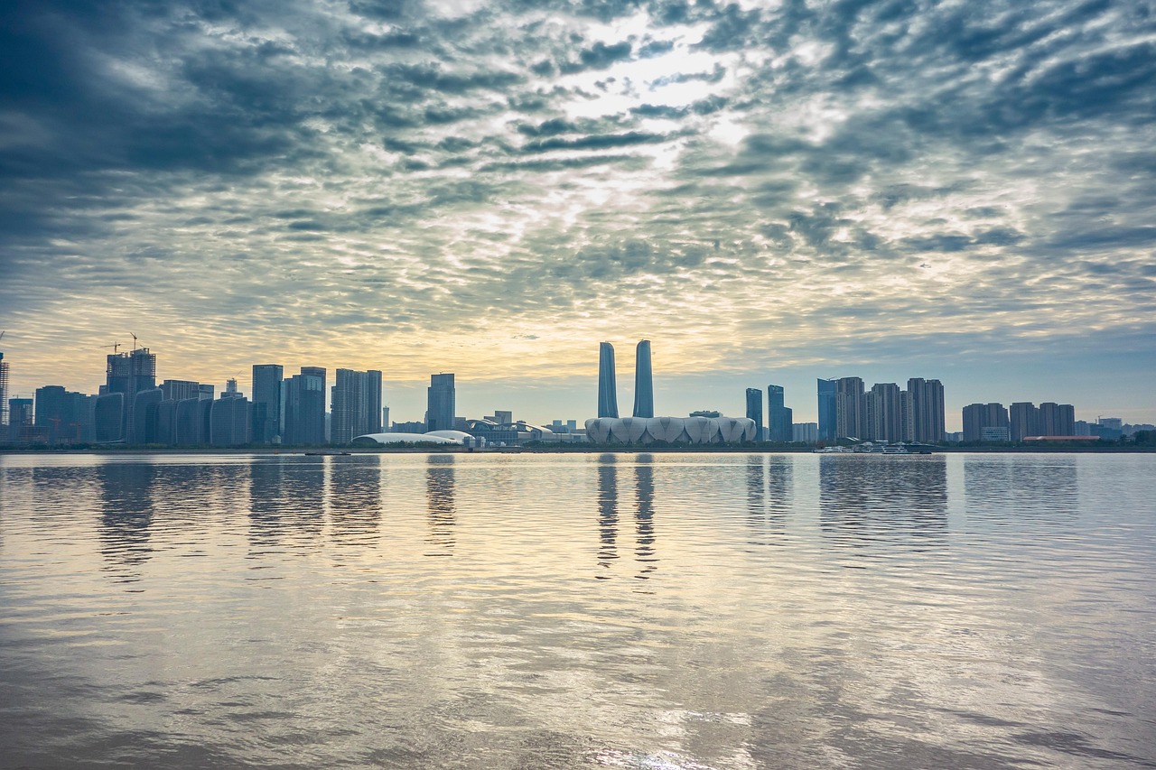 hangzhou  qiantang river  city  river  skyline  skyscrapers  buildings  urban  nature  clouds  sky  water  reflection