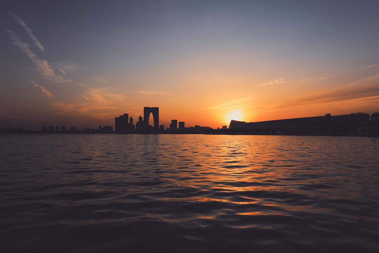 lake  sunset  sky  nature  sunrise  landscape  water  boat  travel  reflection  sea  clouds  sun  dawn  blue  fantasy  calm  blue sky  summer  mood  scenery  dr