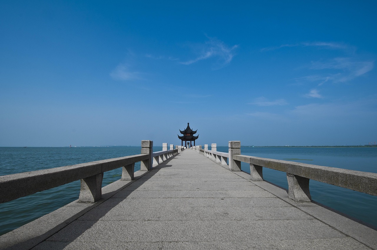 suzhou  start garden  nature  pier  stone embankment  chinese ancient architecture  cornice brackets  sky  taihu