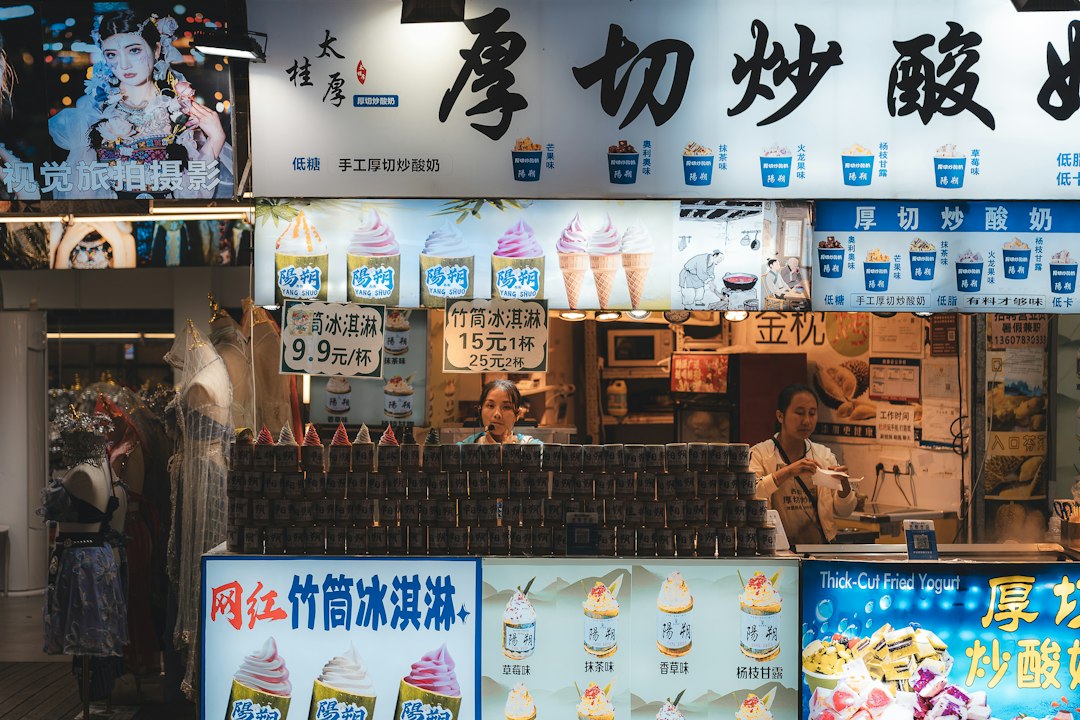 Street food stall with ice cream and signs