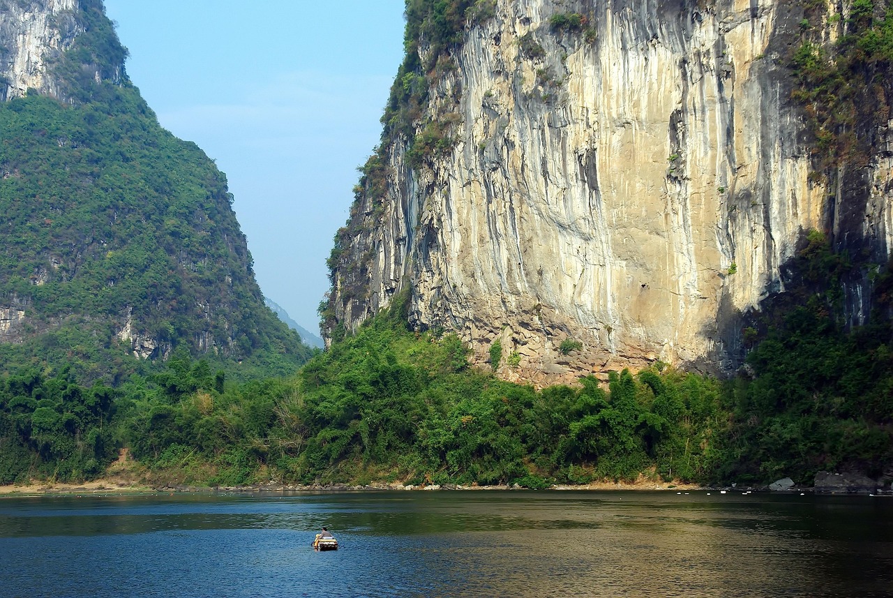 china  yangshuo  nature  li river  navigation  boat  solitude  reflections  mountains  fisherman  water  mist