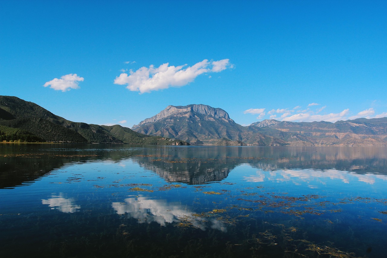 lake  mountains  reflection  sky  clouds  water  mountain range  nature  scenery  scenic  tourist destination  lugu lake  yunnan  china  scenery  lugu lake  lug