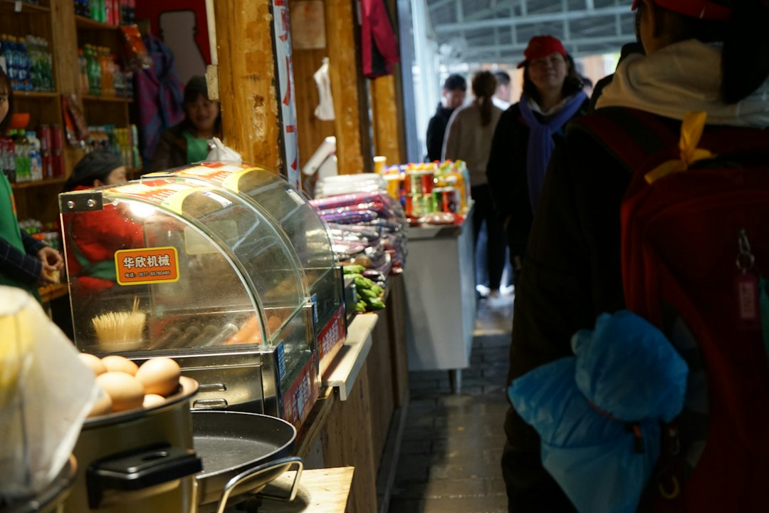 A food vendor stall is displayed with customers