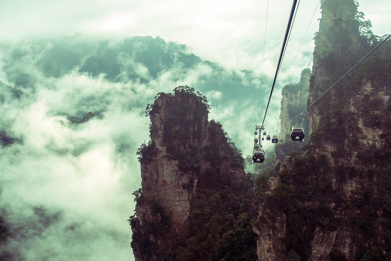 stone peak forest nature cable car clouds zhangjiajie