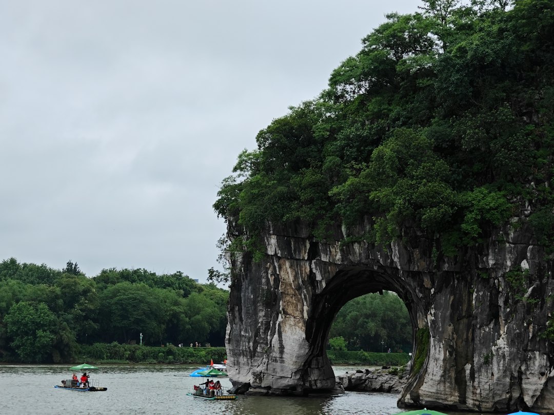 A scenic stone archway over a calm river