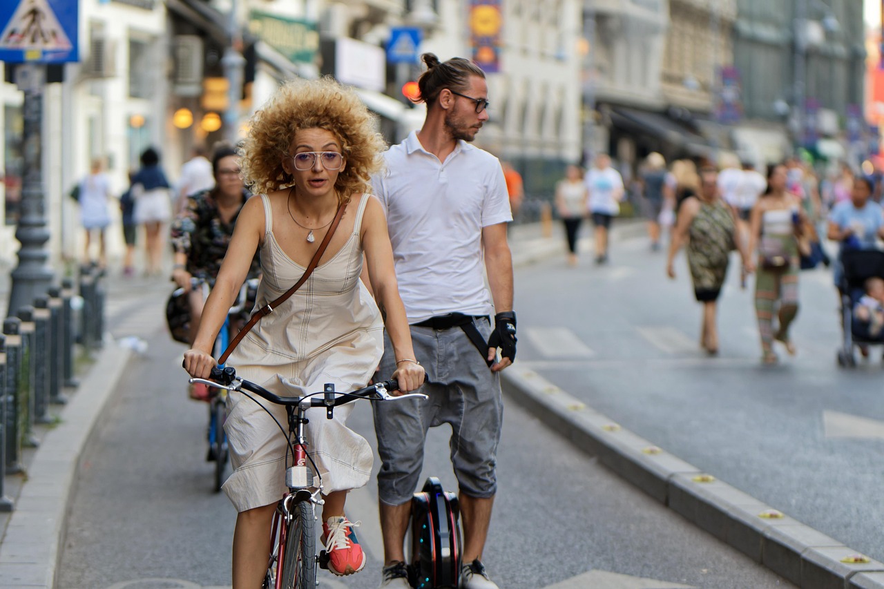 woman bicycle street bike path people promenade man wheel travel urban outdoors bike track lane glasses snapshot street photography weekend tra