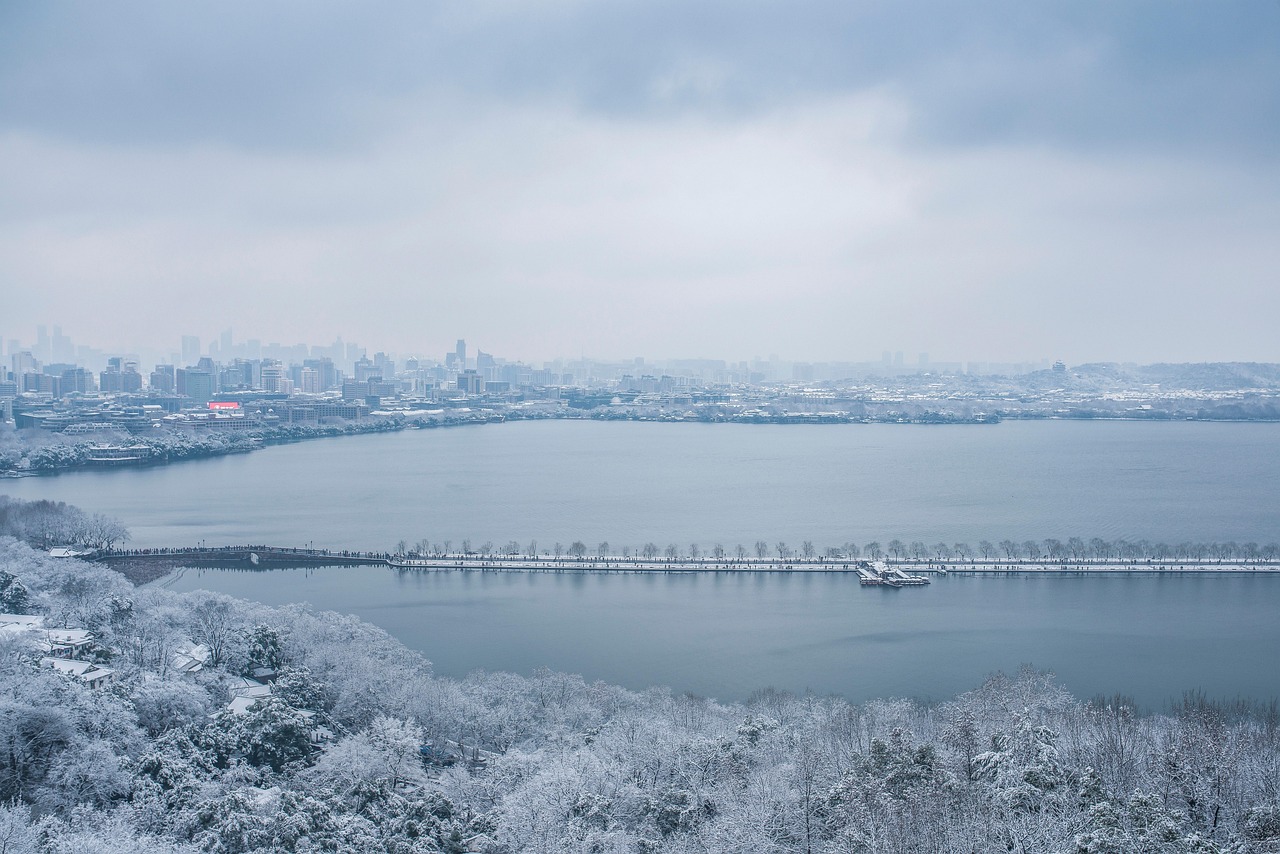 winter city lake nature west lake gem mountain snow water fog cold hangzhou