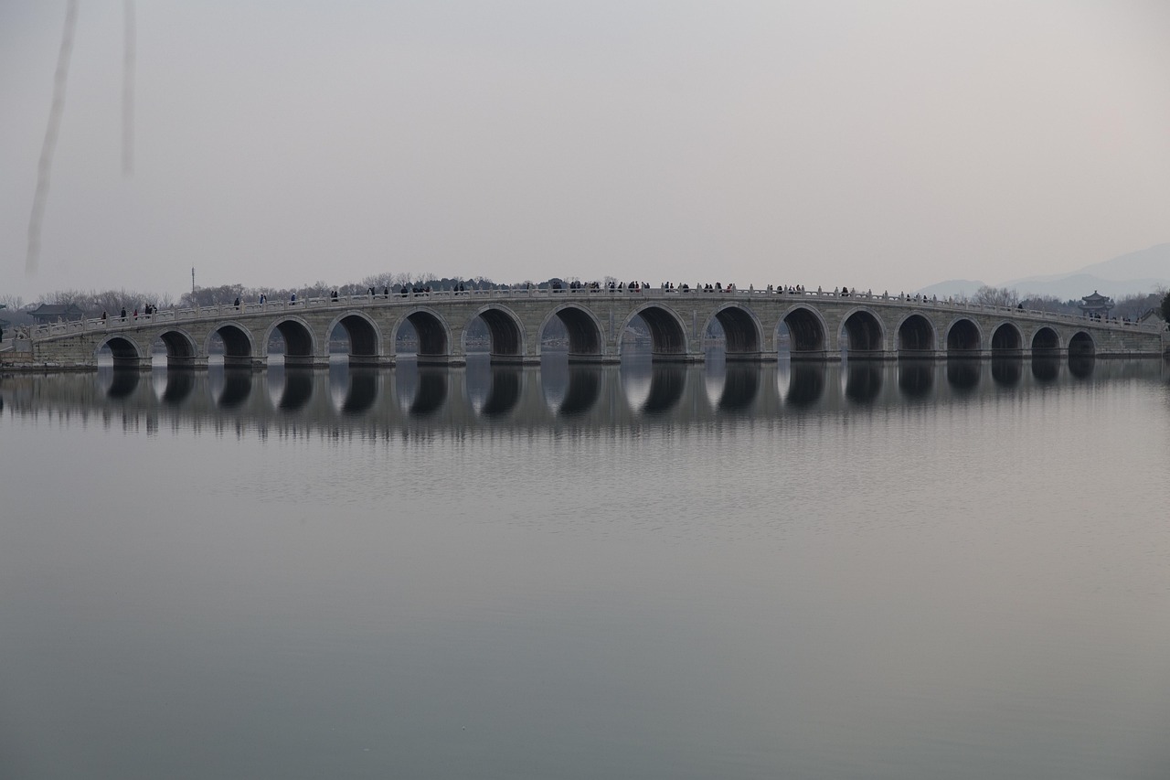stone bridge summer palace reflection kunming lake cloudy day